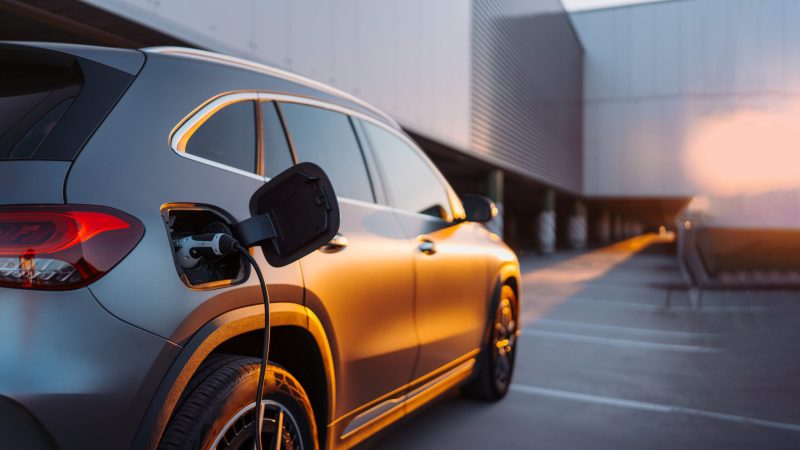 Close-up of electric car charging, concept of ecology transportation.